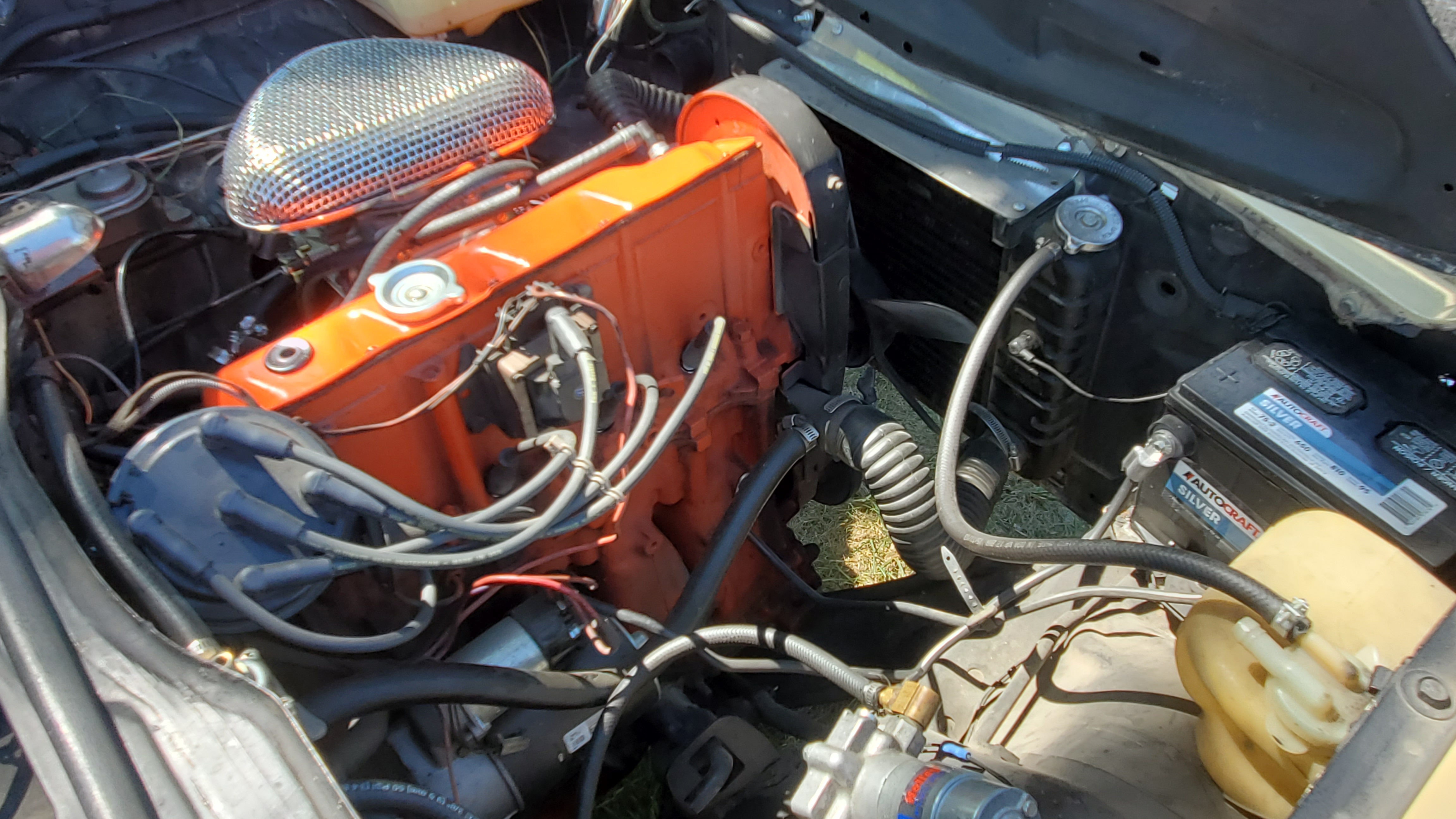 The 2.3 liter stock engine in Doug and Jesse Beckstead's restored 1976 Chevrolet Vega wagon has a four-barrel carburetor on top. Stock carb was half the barrels.