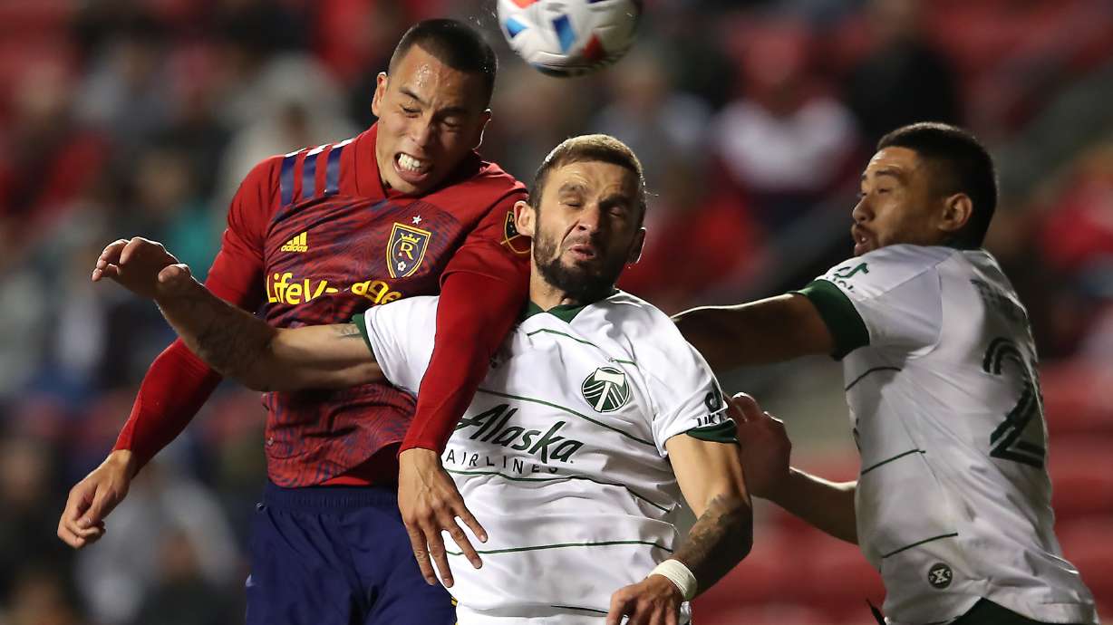 Real Salt Lake forward Bobby Wood (7) battles \Portland Timbers defender Dario Zuparic (13) and Portland Timbers midfielder Ismaila Jome (15) for the ball in front to the Timbers’ goal as the Real Salt Lake and the Portland Timbers play at Rio Tinto Stadium in Sandy Wednesday, Nov. 3, 2021. Timbers won 3-1.