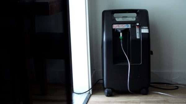 An oxygen concentrator in Francisca Andujo’s home pulls oxygen out of the air for her.