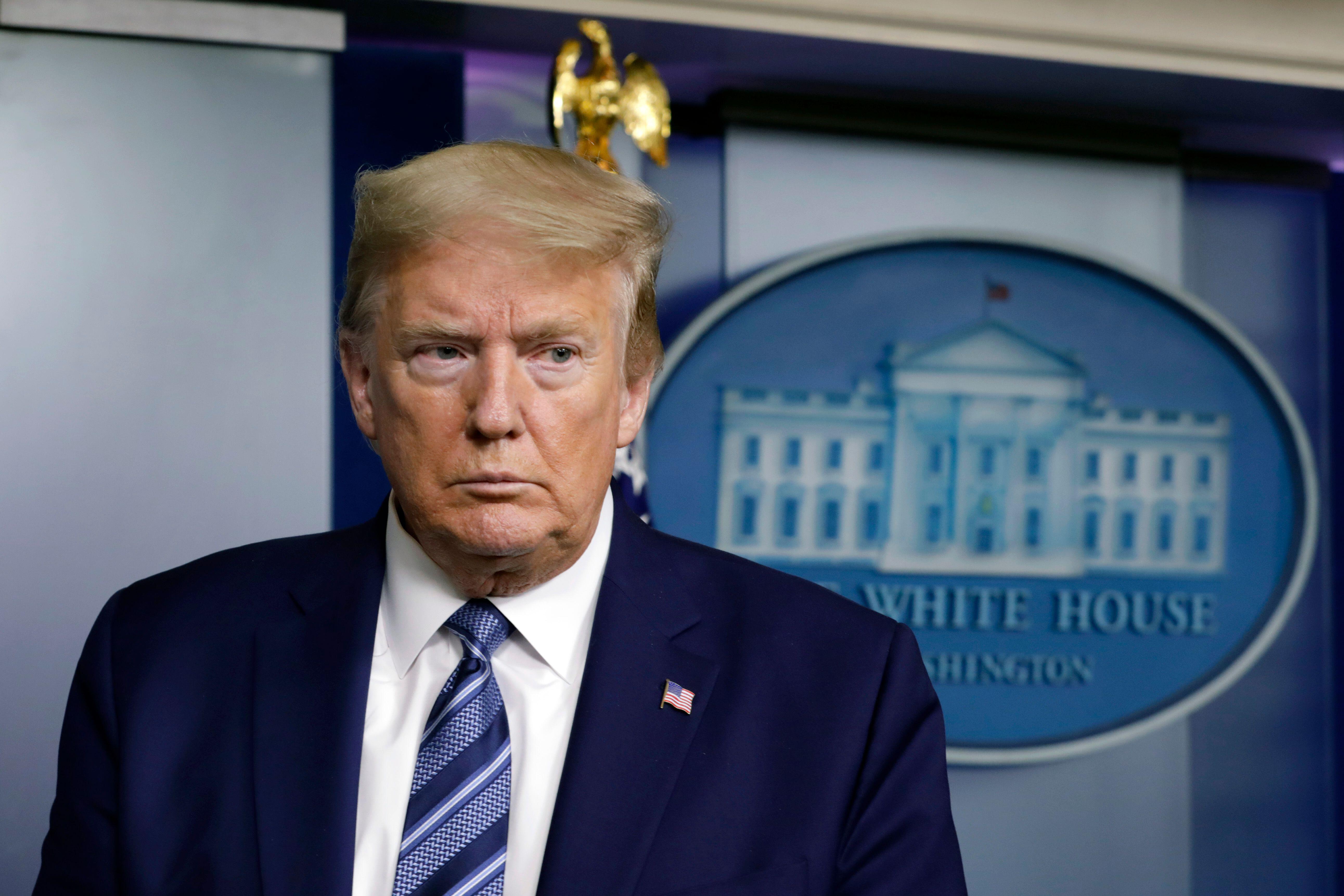 United States President Donald J. Trump speaks at the White House in Washington on April 21, 2020. A Russian analyst who contributed to a dossier of Democratic-funded research into ties between Russia and Trump was indicted Thursday on charges of lying to the FBI about his sources of information