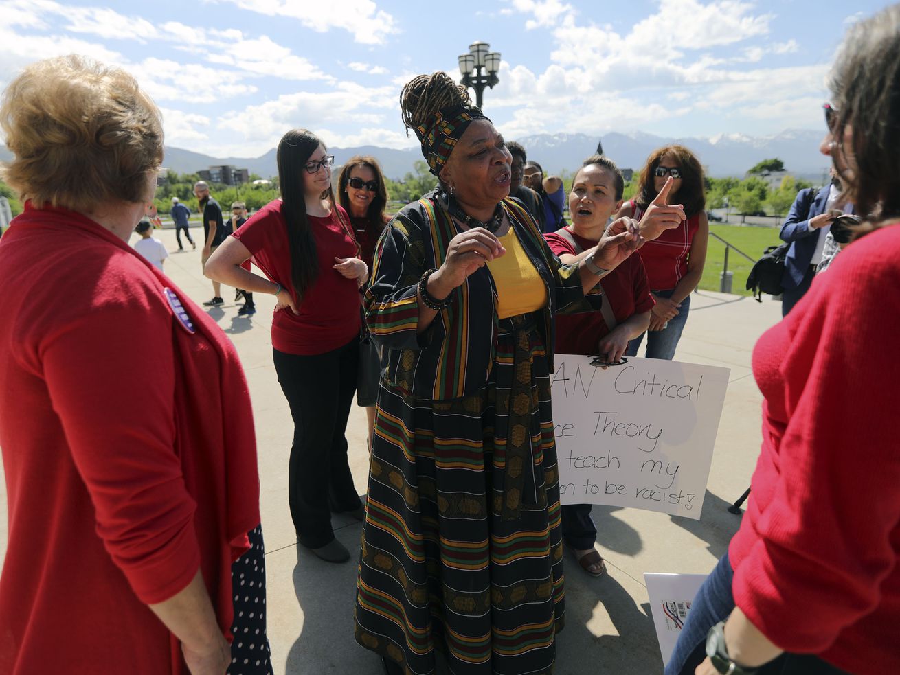 Betty Sawyer, a supporter of critical race theory,
center, exchanges views with a group of women opposed to the
theory, after a protest organized by the Utah Educational Equity
Coalition outside of the Capitol in Salt Lake City on May 19.