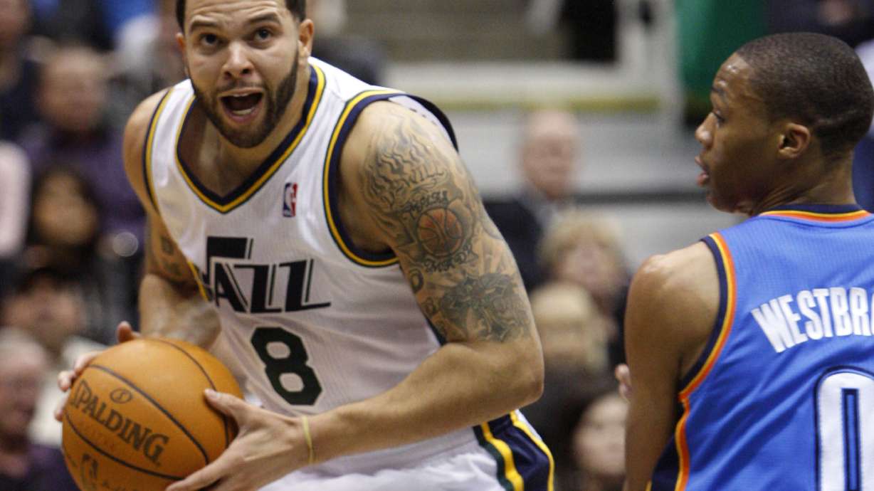 Deron Williams #8 of the Utah Jazz drives past Oklahoma City's #0 Russell Westbrook as the Utah Jazz play the Oklahoma City Thunder Saturday, Feb. 5, 2011 at Energy Solutions Arena.