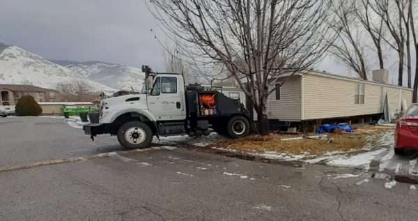Lindsey Duncan’s mobile home is hauled away after the park where she resided closed.