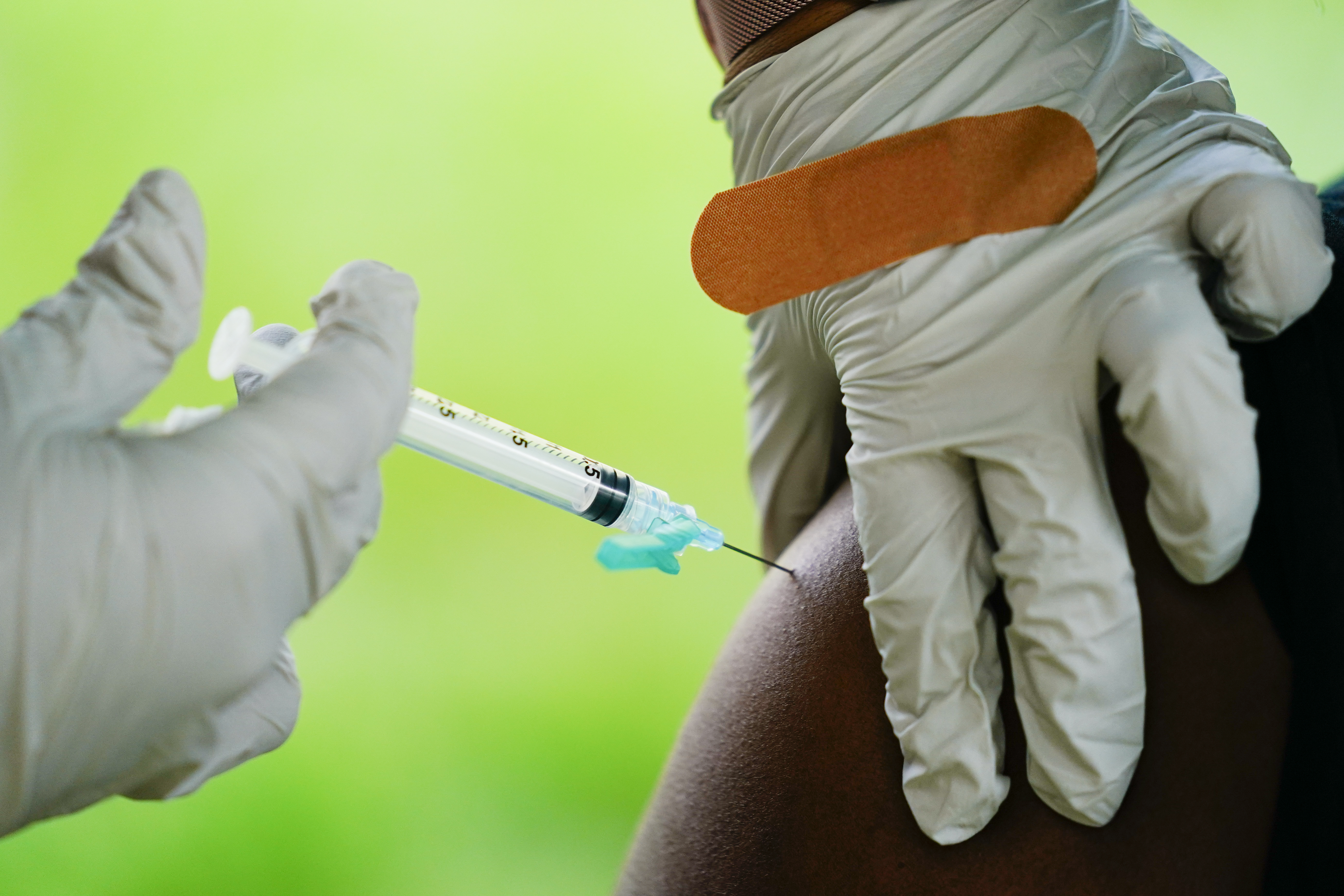 A health worker administers a dose of a Pfizer COVID-19 vaccine at a vaccination clinic in Reading, Pennsylvania, on Sept. 14.