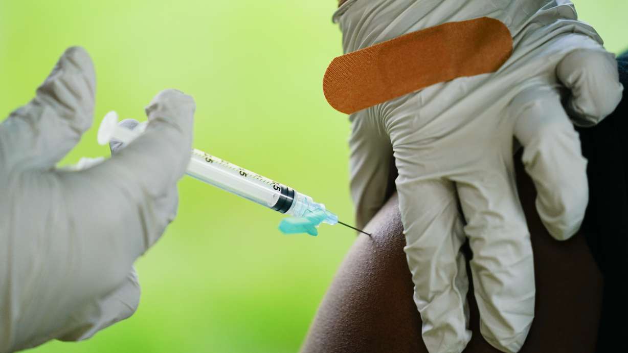 A health worker administers a dose of a Pfizer COVID-19 vaccine at a vaccination clinic in Reading, Pennsylvania, on Sept. 14.