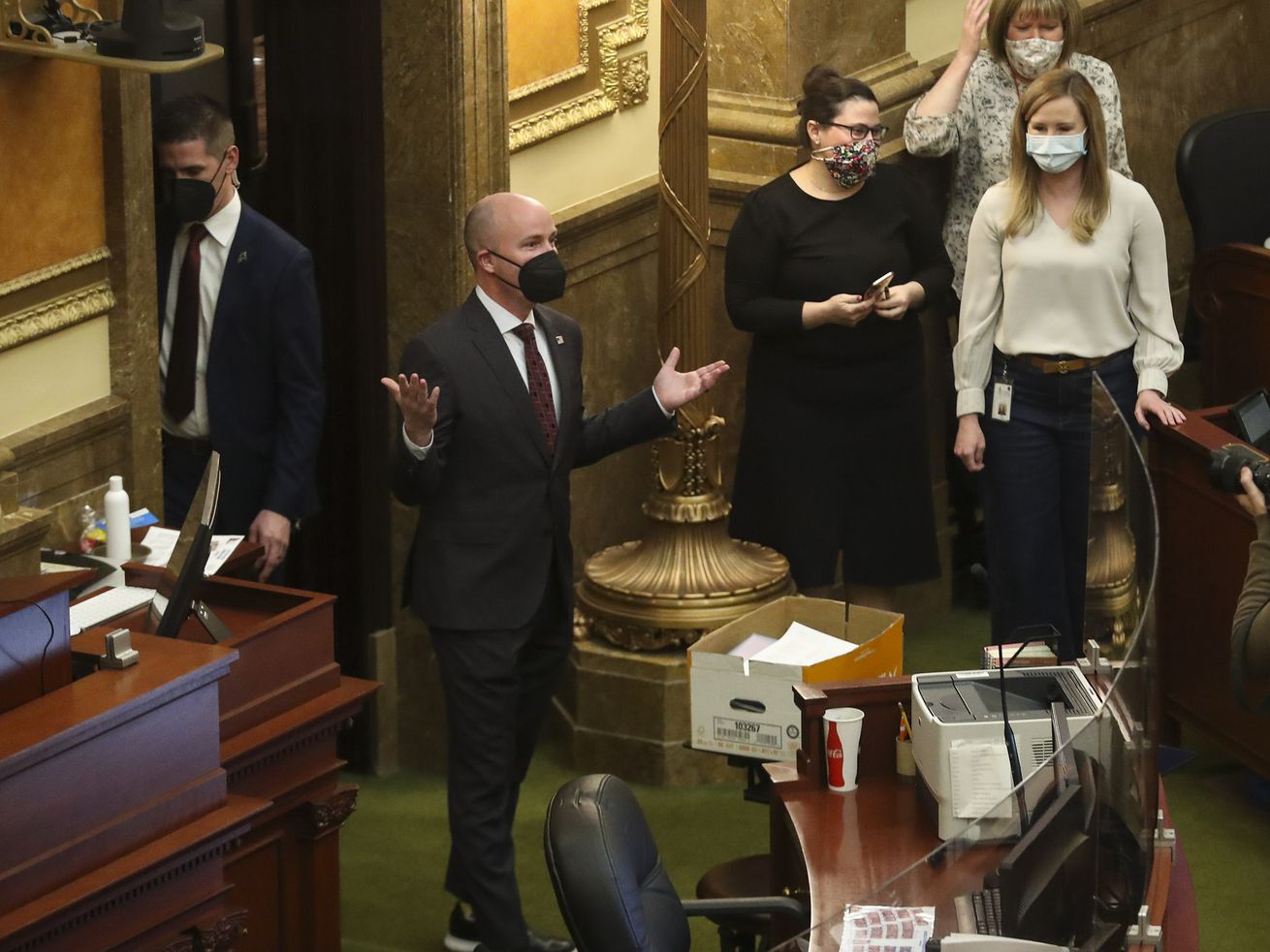 Gov. Spencer Cox, center, throws his hands in the air
as he enters the House chamber after jokingly being introduced as
Gov. Gary Herbert by Rep. Francis Gibson, R-Mapleton, at the end of
the 2021 legislative session in the House chamber at the Capitol in
Salt Lake City on Friday, March 5. Cox on Friday officially
called the Utah Legislature into a special session, set to begin
Tuesday at 10:30 a.m.