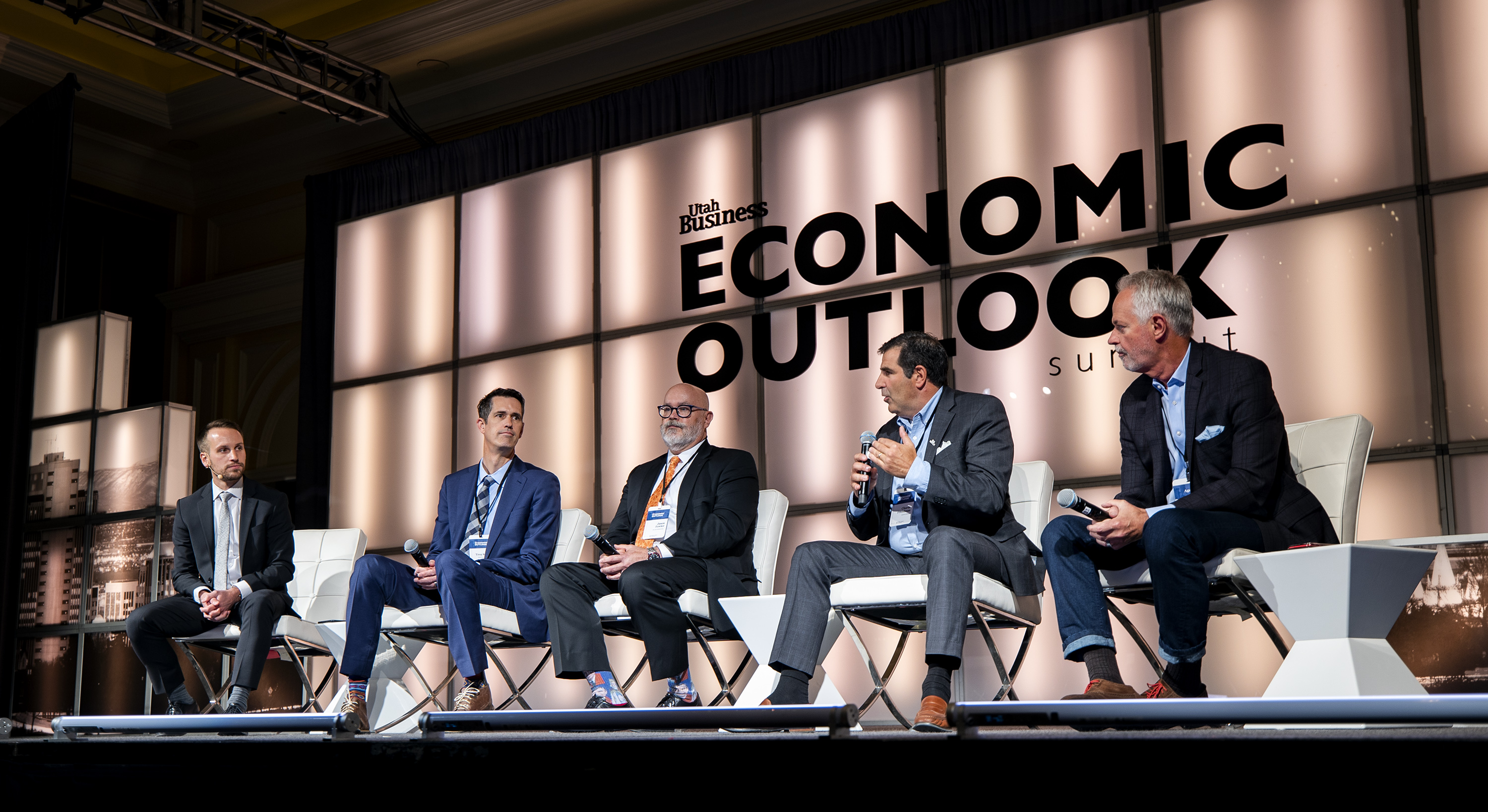 Stephen LeFevre, director of strategic and foreign affairs for World Trade Center Utah, left, moderates a discussion on supply chain issues and the impact on local businesses during the Utah Business Economic Outlook Summit at the Grand America Hotel in Salt Lake City on Friday.