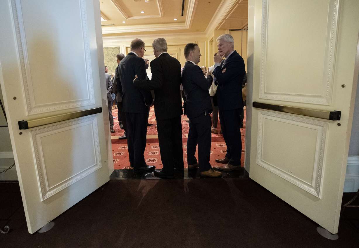 Attendees talk during a break at the Utah Business Economic Outlook Summit at the Grand America Hotel in Salt Lake City on Friday.