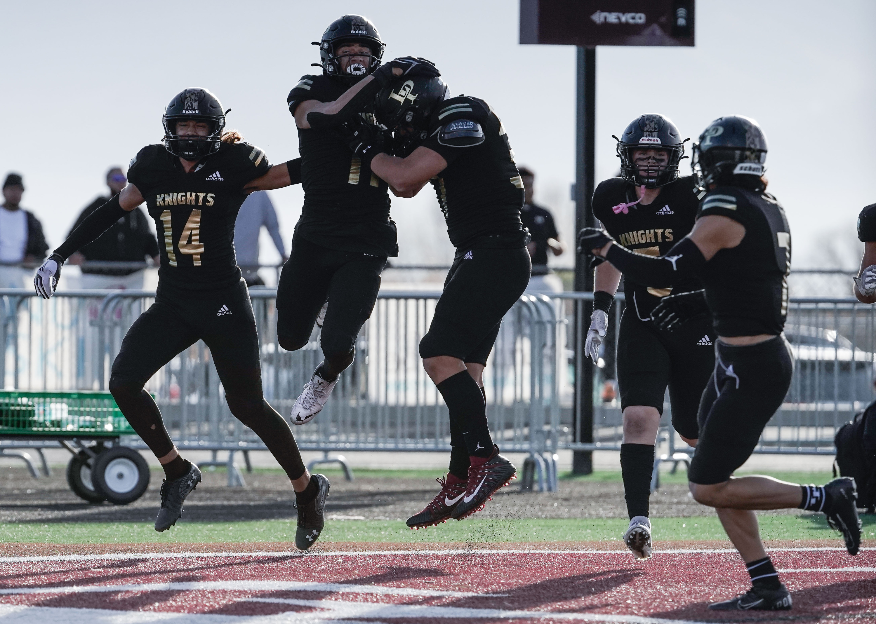 Lone Peak football players celebrates a touchdown during the second half of the the 6A quarterfinal football game against Bingham on Friday, Nov. 5, 2021 at Lone Peak High School in Highland .