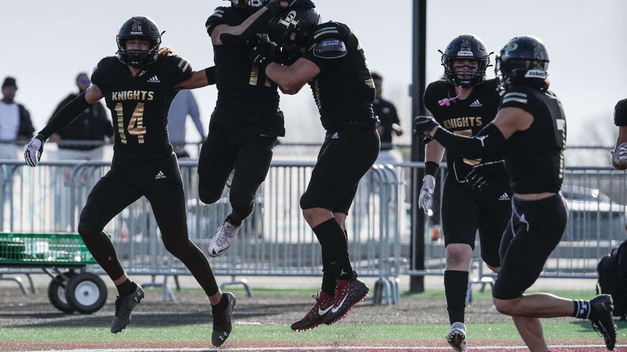 Lone Peak football players celebrates a touchdown during the second half of the the 6A quarterfinal football game against Bingham on Friday, Nov. 5, 2021 at Lone Peak High School in Highland .
