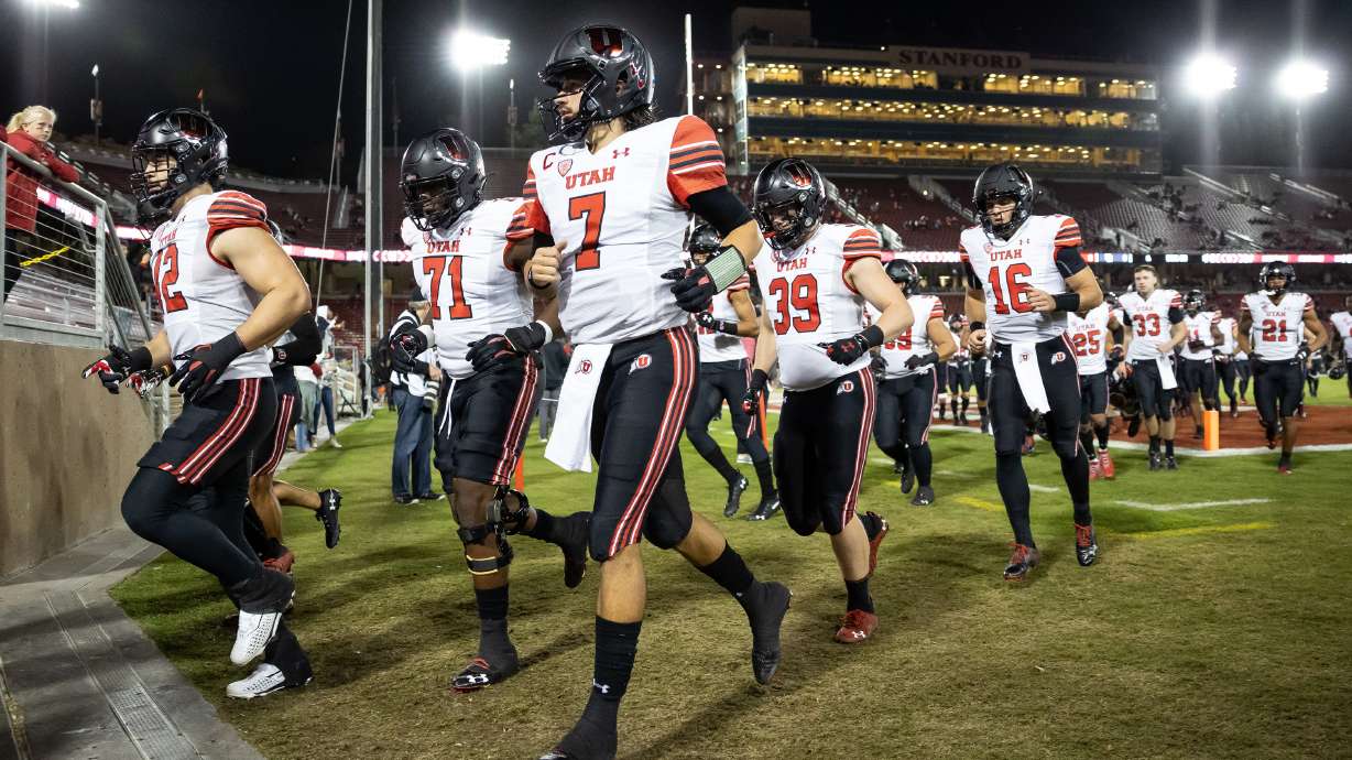 Utah Utes quarterback Cameron Rising (7) and teammates finish warmups before the game against the Stanford Cardinal in Stanford, Calif., on Friday, Nov. 5, 2021.