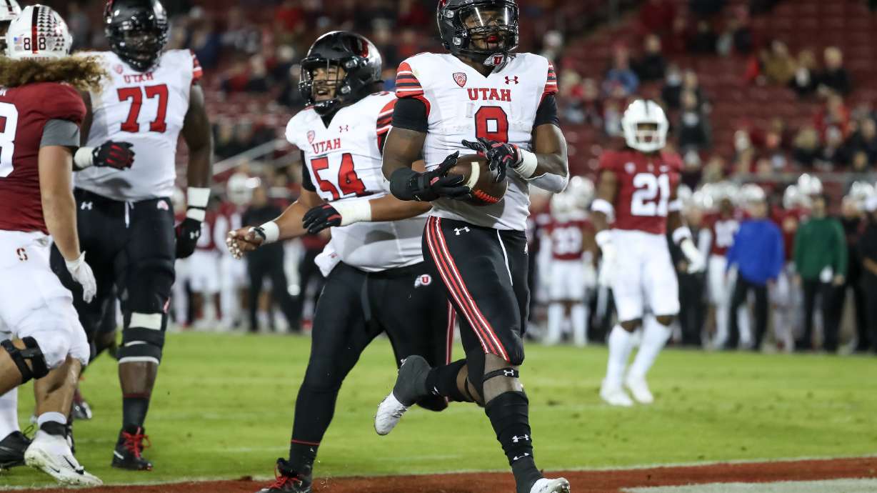 Utah Utes running back Tavion Thomas (9) runs in for his second touchdown, putting the Utes up 14-0 over the Stanford Cardinal after the PAT, in Stanford, Calif. on Friday, Nov. 5, 2021.