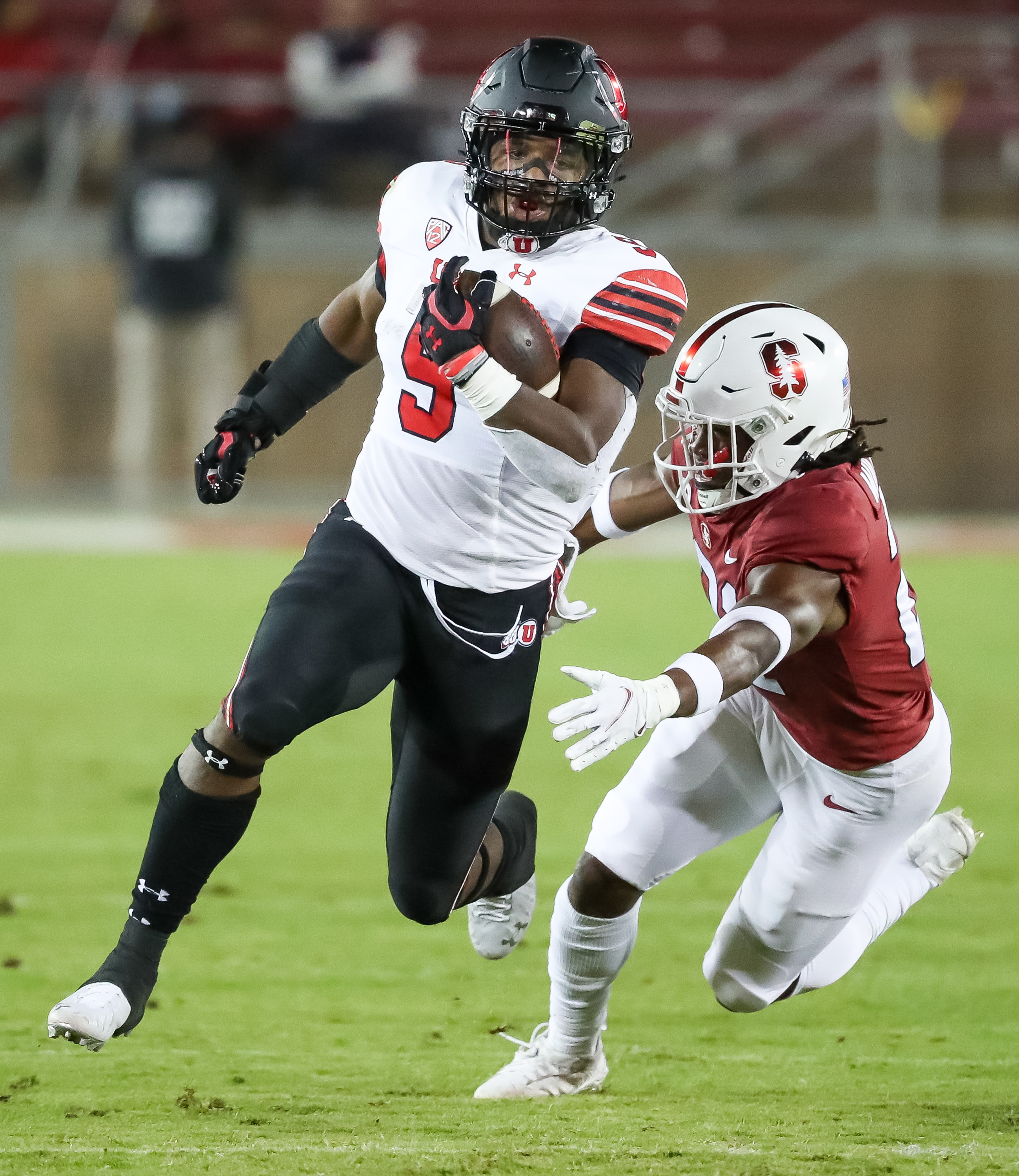 Utah Utes running back Tavion Thomas (9) gets ahead of Stanford Cardinal safety Kendall Williamson (21) in Stanford, Calif. on Nov. 5, 2021. Thomas faces kidnapping and assault charges in a domestic violence investigation.