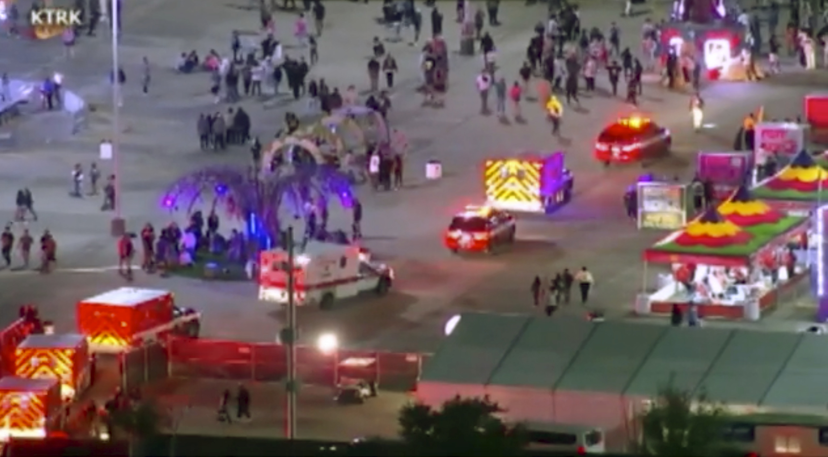 Emergency personnel respond to the Astroworld music festival in Houston on Friday. Several people died and numerous others were injured in what officials described as a surge of the crowd at the music festival while Travis Scott was performing.