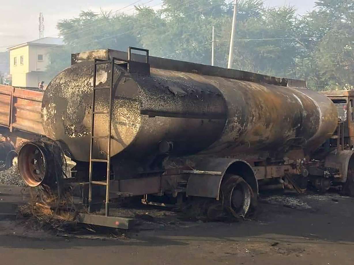 People gather at the scene of a tanker explosion after it was struck by a truck in the Wellington suburb of Sierra Leone's capital Freetown Saturday.