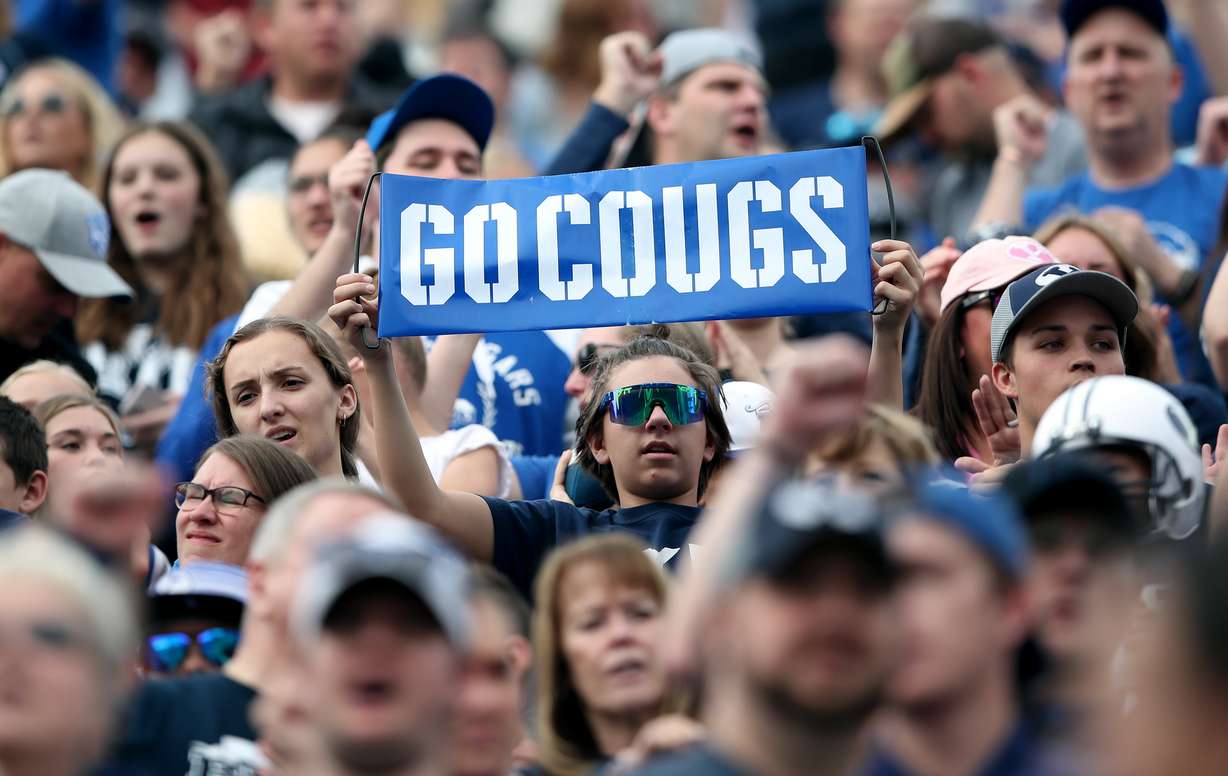 A fan holds a “Go Cougs” sign as the BYU Cougars and Idaho State Bengals play at LaVell Edwards Stadium in Provo on Saturday, Nov. 6, 2021.