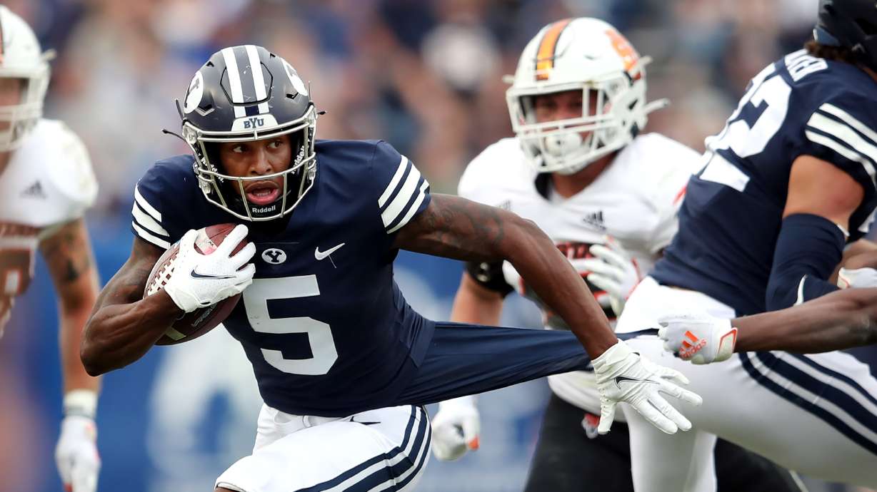 Brigham Young Cougars wide receiver Chris Jackson (5) fights to get free on a run as the BYU Cougars and Idaho State Bengals play at LaVell Edwards Stadium in Provo on Saturday, Nov. 6, 2021.
