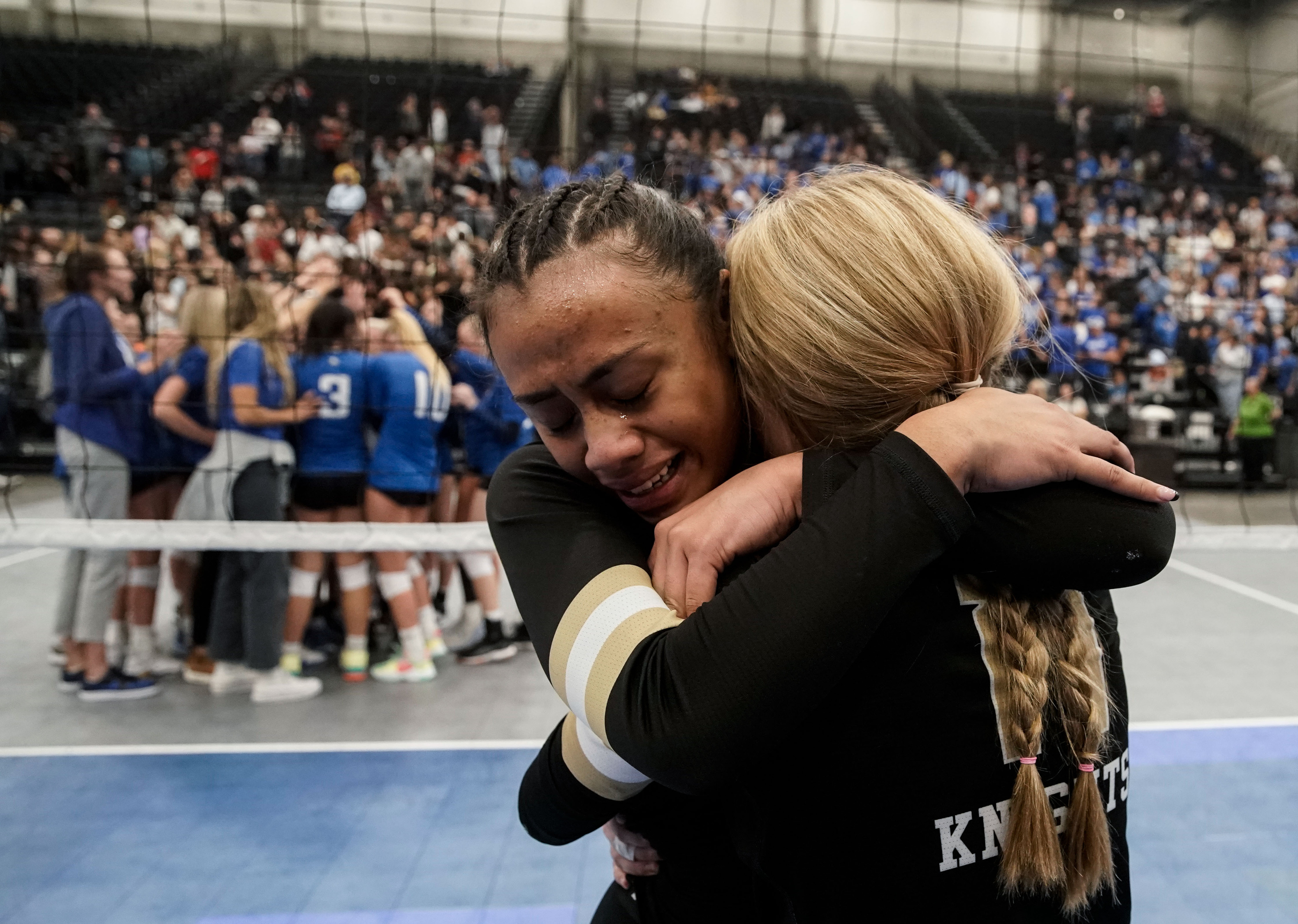 Lone Peak’s Jayda Tupea, left, and Kalia Kohler embrace each other as they celebrate their win against Pleasant Grove in the 6A volleyball state championship at the UCCU Center in Orem on Saturday, Nov. 6, 2021.