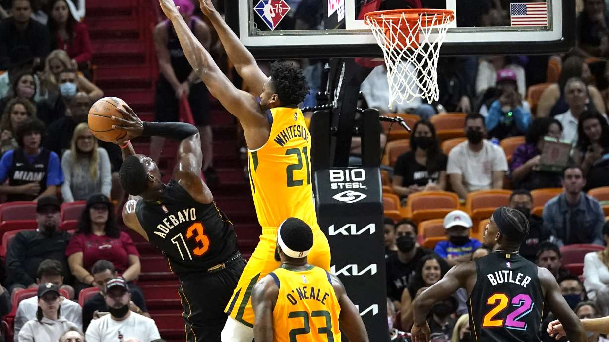 Miami Heat center Bam Adebayo (13) shoots as Utah Jazz center Hassan Whiteside (21) defends during the first half of an NBA basketball game, Saturday, Nov. 6, 2021, in Miami.