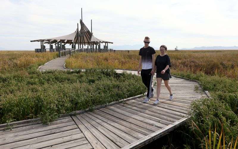 Garrett Skidmore and Maddie Dabling walk through the
Great Salt Lake Shorelands Preserve in Layton on Monday, Sept. 13. The 4,400-acre preserve was The Nature Conservancy’s first
preserve in Utah and is used by between 4 million and 6 million
birds annually.