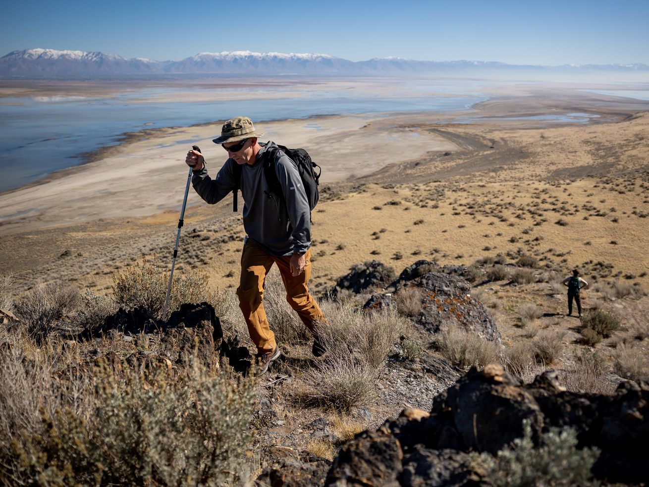 Jason Curry, deputy director of the Utah Division of
Forestry, Fire and State Lands, and Marisa Weinberg, a minerals and
surface lease analyst, hike on Fremont Island while giving
journalists a tour on Thursday, Oct. 21.