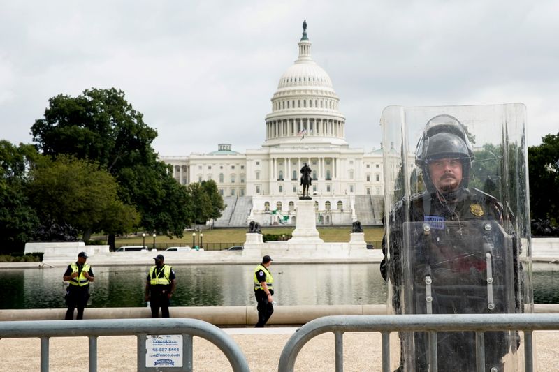 A riot police officer stands guard during a rally in support of defendants being prosecuted in the January 6 attack on the Capitol in Washington on September 18, 2021.