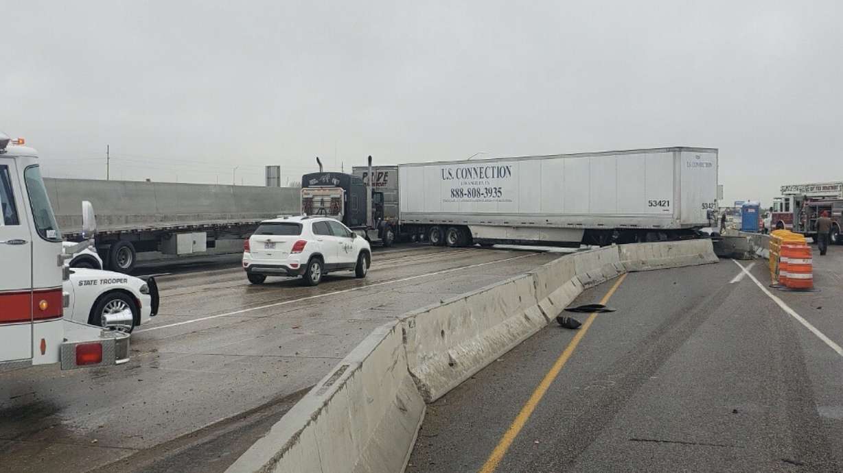 Semitrucks block southbound I-15 near Roy on Tuesday.