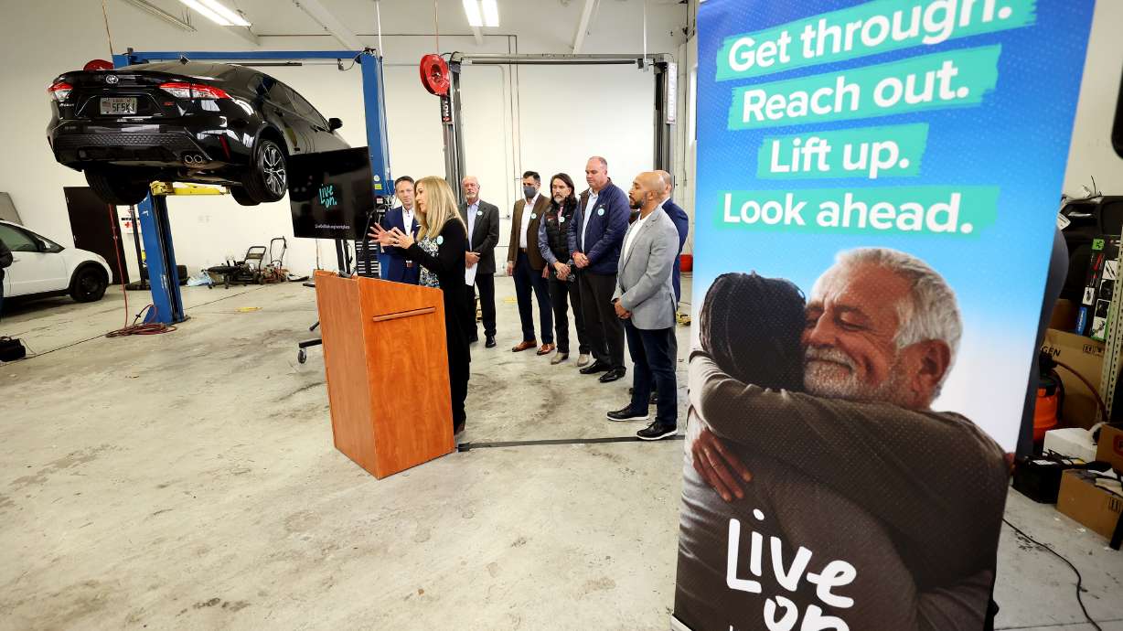 Judy Copier, market president for iHeart Media, speaks as the Salt Lake Chamber and business leaders hosts a press event unveiling a new suicide prevention and mental health campaign dedicated to helping employers and employees from the private sector, at Strong Volkswagen used cars in Salt Lake City on Tuesday.