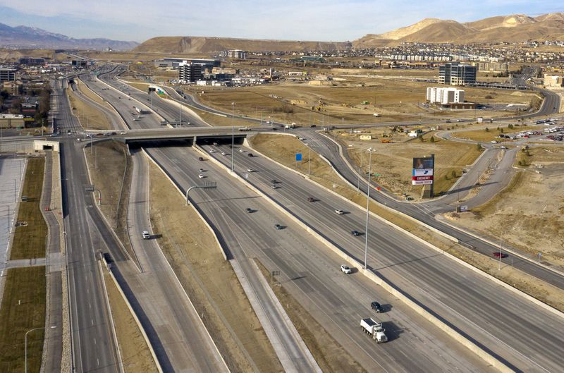 Traffic moves along I-15 as it passes under Triumph
Boulevard in Lehi on Dec. 16, 2020. The interchange was added as
part of the Utah Department of Transportation’s Technology Corridor
project, a three-year project that brought major revisions to I-15,
interchanges and surrounding roads from Lehi Main Street to state
Route 92.
