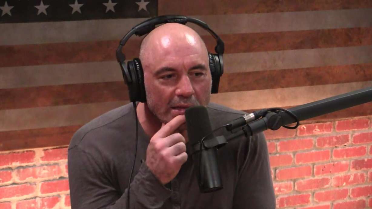 Comedian Joe Rogan hosts an episode of “The Joe Rogan Experience” in this image from YouTube. Green Bay Packers quarterback Aaron Rodgers, under fire for not being vaccinated for COVID-19, says he developed his own health protocol after consulting with doctors and the comedian and podcaster.