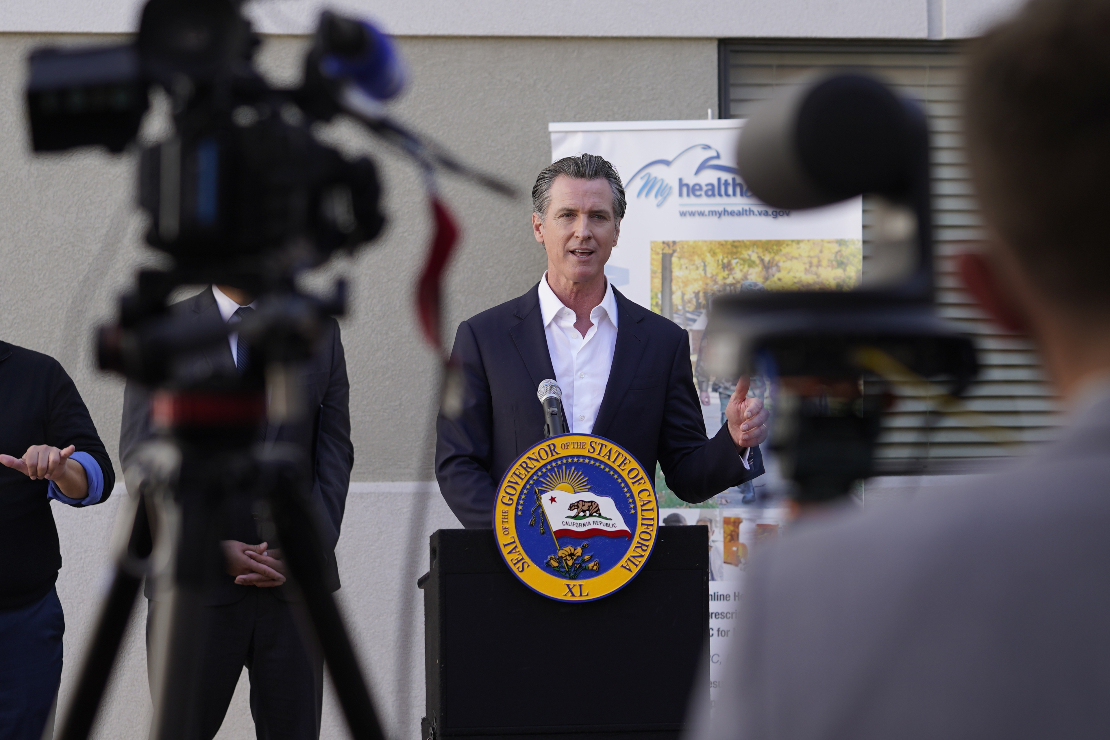 California Gov. Gavin Newsom takes questions from the media after a visit to a COVID-19 vaccine clinic at the VA Greater Los Angeles Healthcare System to promote vaccinations and booster shots in Los Angeles on Nov. 10. 
