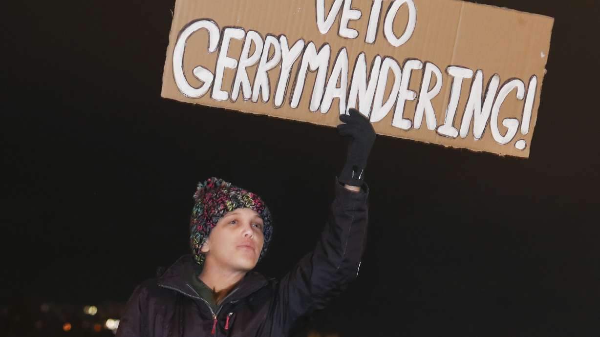 Amanda Roos of Lehi attends a rally in opposition to the proposed congressional district maps at the Capitol in Salt Lake City on Wednesday. The map slices Utah’s capital, the Democratic stronghold of Salt Lake City, and dissects areas like Sugar House, Millcreek, Murray and Holladay into four congressional districts.
