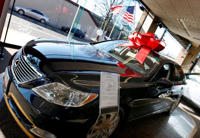 Cars sit for sale in a Lexus dealership in Greenwich, Connecticut, Nov. 17, 2008. Automakers and dealers are on track to spend less on advertising this holiday season, experts say, leaving behind the generous lease deals and discounts of seasons past.