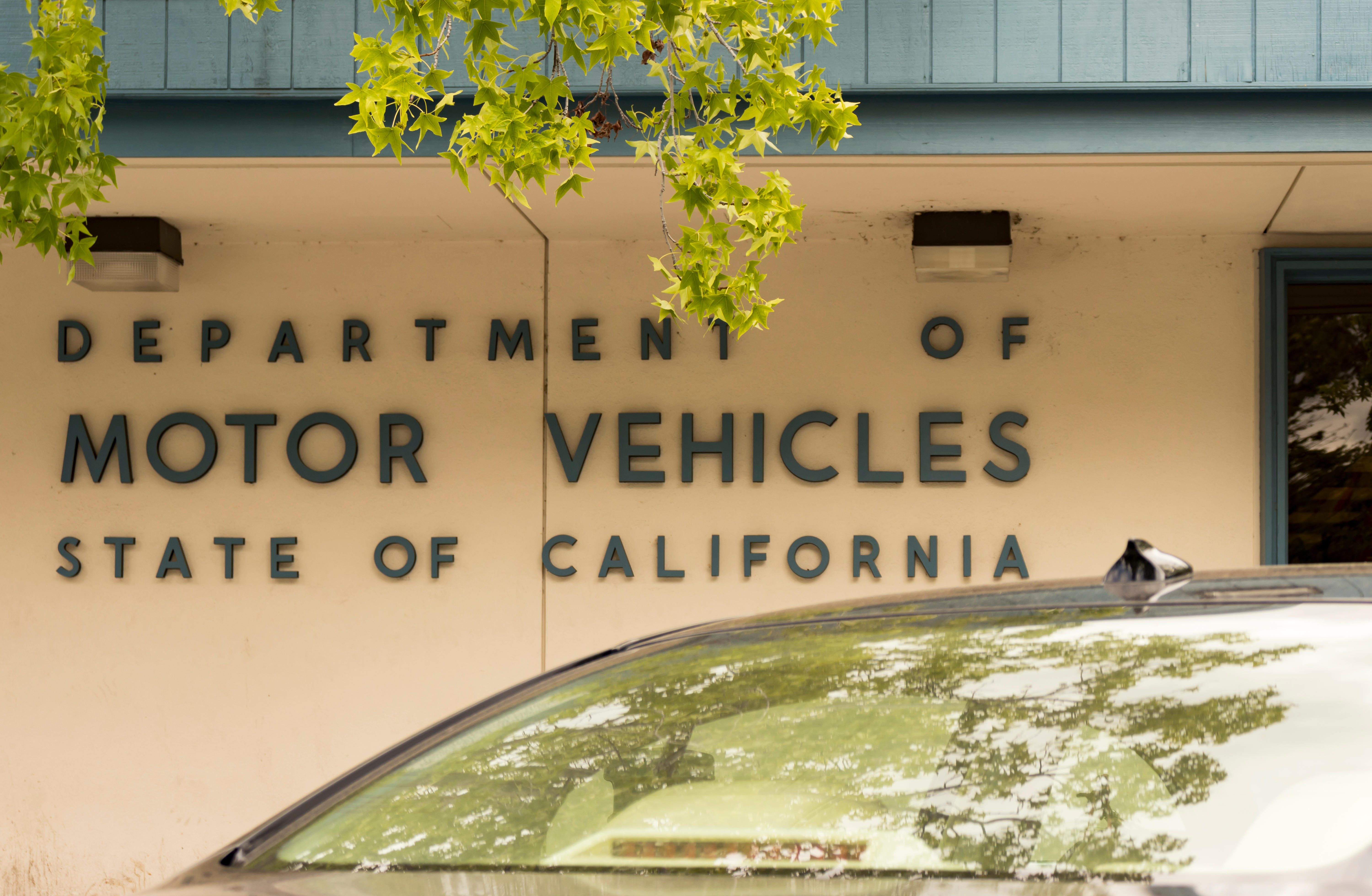 State of California Department of Motor Vehicles sign in the town of Los Gatos, on May 16, 2018. A California man is dying to get his driver's license renewed — he just needs to be declared living again.