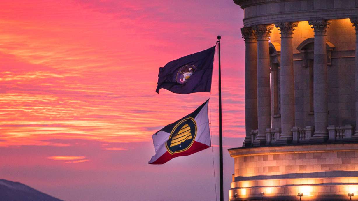 The Utah state flag and a commemorative state flag celebrating Utah's 125 years of statehood fly over the state Capitol on Oct. 30. A task force charged with looking at a possible new state flag had its sunset date extended with a bill that passed during Wednesday's special legislative session.
