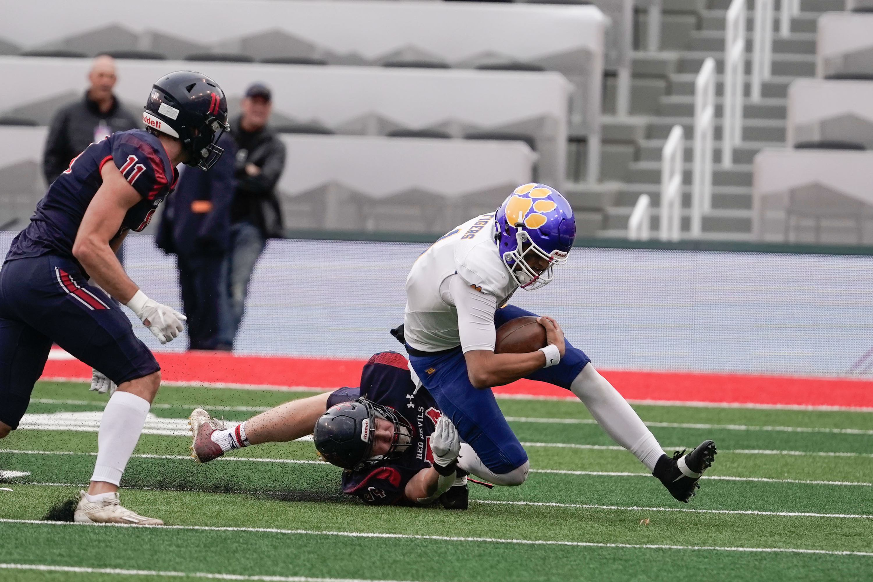 Orem’s Chase Tuatagaloa, right, gets tackled by Springville’s Porter Small as they compete in the 5A football semifinal game on Thursday, Nov. 11, 2021 at Rice-Eccles Stadium in Salt Lake City .