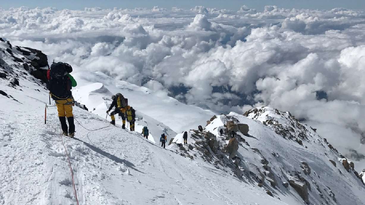 An undated photo of hikers descending Mount Denali to a camp at 14,000 feet in Alaska. Charges filed in U.S. District Court accuse a Utah man of lying about other hikers with him having early signs of hypothermia in an attempt to have a helicopter rescue the group.