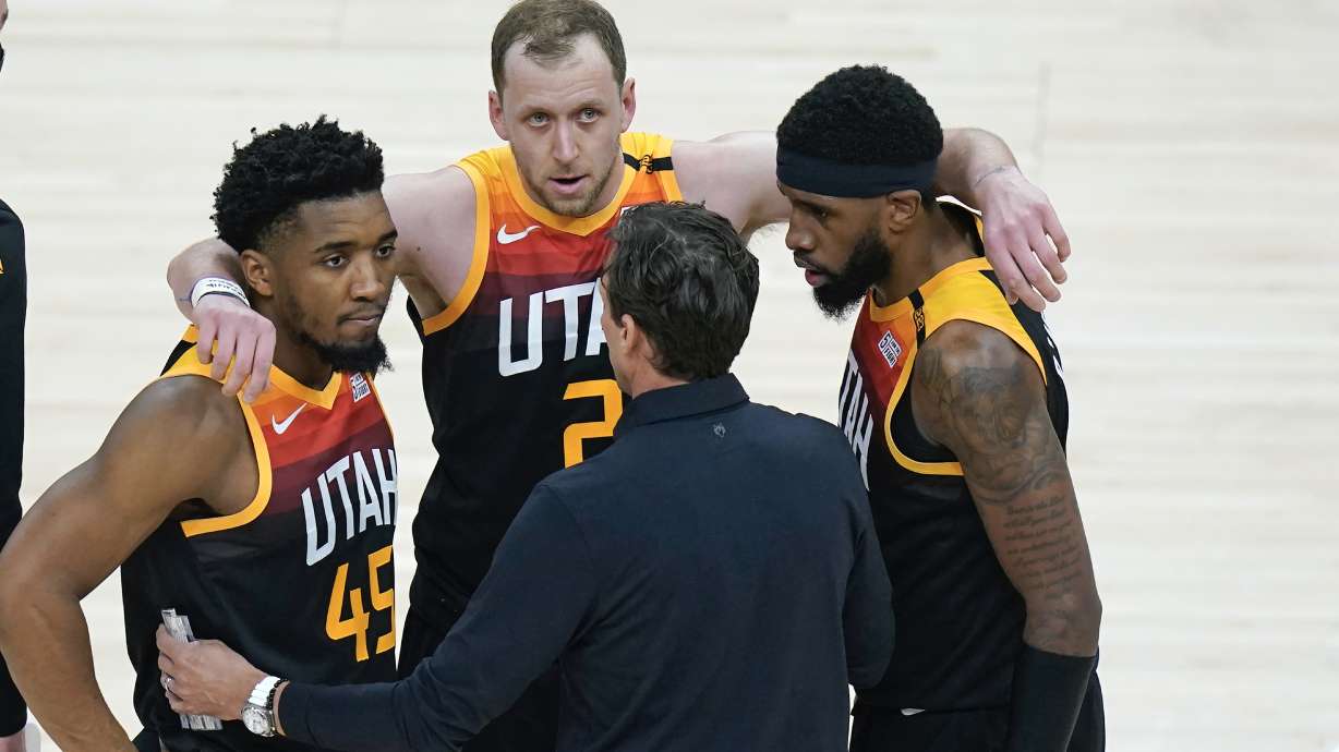 Utah Jazz coach Quin Snyder huddles with Donovan Mitchell (45), Joe Ingles (2) Royce O'Neale during the second half of Game 5 of the team's NBA basketball first-round playoff series against the Memphis Grizzlies on Wednesday, June 2, 2021, in Salt Lake City.