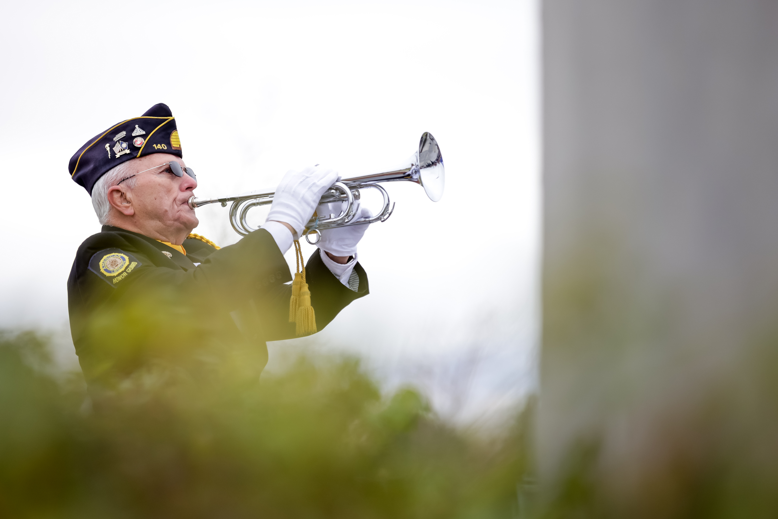 Ron Tranmer, the bugler for American Legion Post 140 and a Marine Corps veteran, plays taps during a Veterans Day ceremony at Veterans Memorial Park in West Jordan on Thursday.