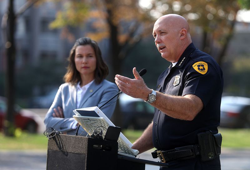 Salt Lake City Mayor Erin Mendenhall, left, listens as
Police Chief Mike Brown talks about the city’s crime rates during a
press conference at Pioneer Park on Sept. 7.