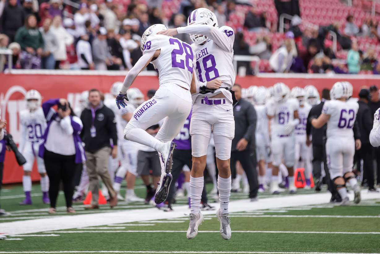 Lehi’s Carson Gonzalez and Jaxson Shepherd celebrate after a touchdown in a 5A football semifinal game against Stansbury at Rice-Eccles Stadium in Salt Lake City on Thursday, Nov. 11, 2021.