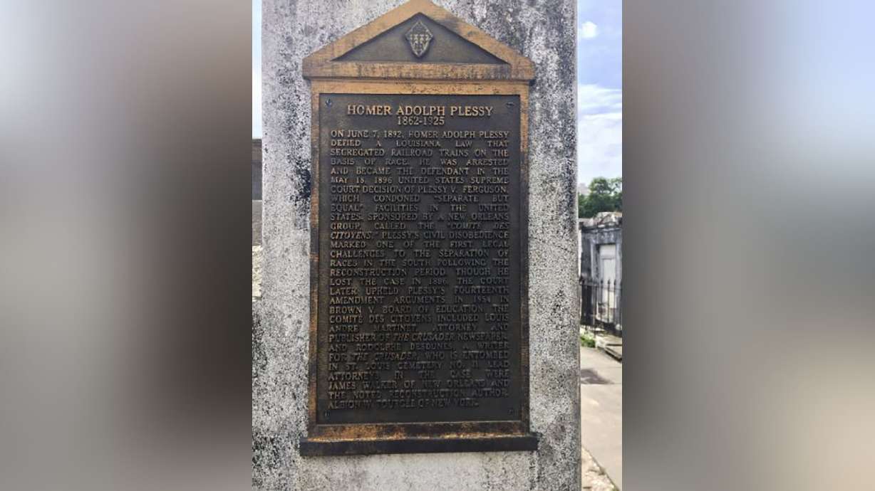 A marker on the burial site for Homer Plessy at St. Louis No. 1 Cemetery in New Orleans June 3, 2018. A Louisiana board on Friday posthumously pardoned Plessy.
