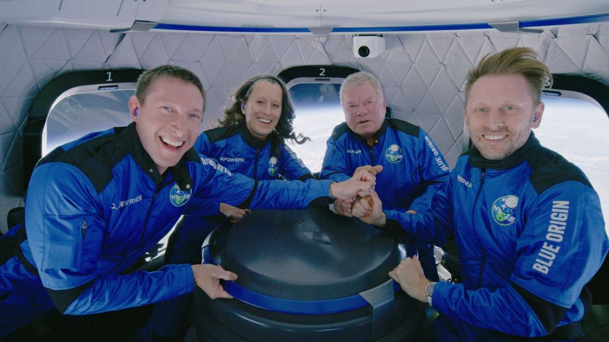 This photo provided by Blue Origin shows Blue Origin's New Shepard rocket space passengers from left, Glen de Vries, Audrey Powers, William Shatner, and Chris Boshuizen pose inside the capsule on Wednesday, Oct. 13. The “Star Trek” actor and three fellow passengers hurtled to an altitude of 66.5 miles over the West Texas desert in the fully automated capsule, then safely parachuted back to Earth in a flight that lasted just over 10 minutes.