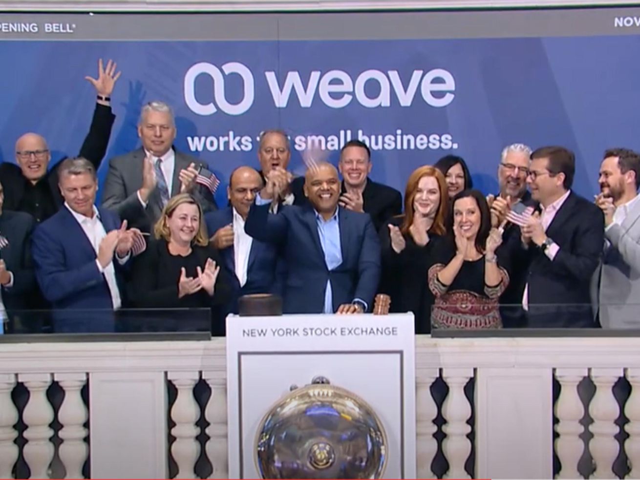 Weave CEO Roy Banks, center, celebrates with his team
during the company’s debut on the New York Stock Exchange on
Thursday.