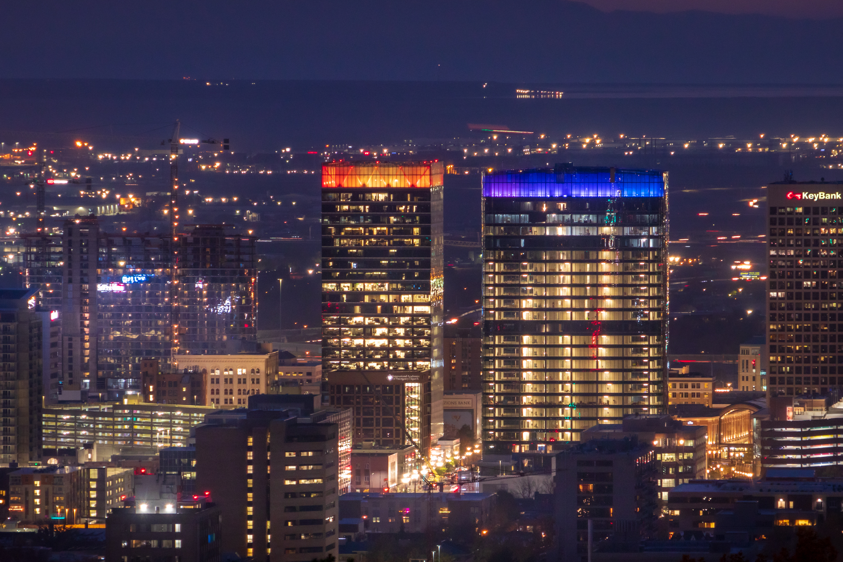 The 95 State, with the blue-lit top, lit up the night on Nov. 5. The Hyatt Regency Salt Lake City hotel can be seen on the far left. Both will be among the 10 tallest completed buildings in Salt Lake City by the end of 2022.
