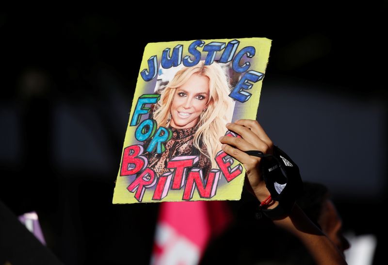A supporter of singer Britney Spears holds up a picture of the pop star with the words "Justice for Britney" during celebrations for the termination of her conservatorship, outside the Stanley Mosk Courthouse in Los Angeles on Nov. 12.