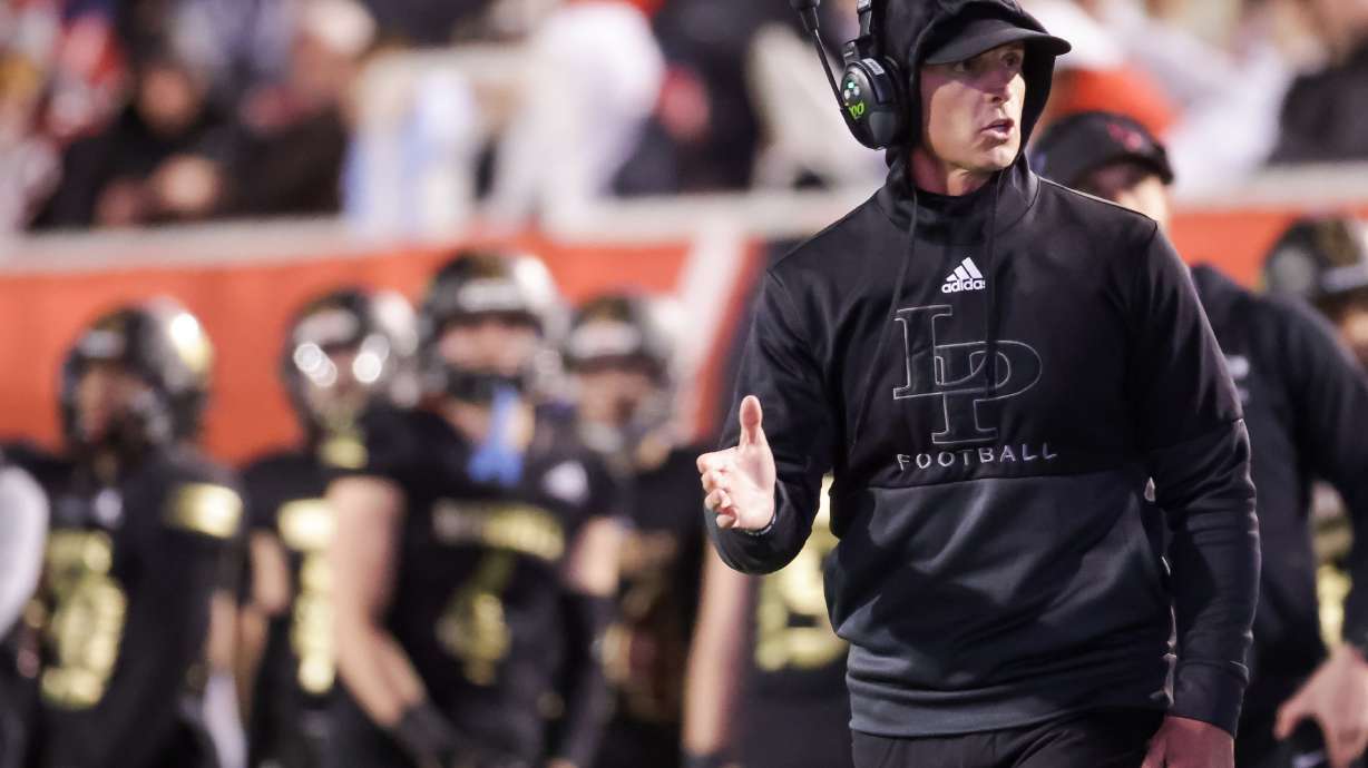 Lone Peak head coach Bart Brockbank works the sideline in a 6A football semifinal game against Skyridge at Rice-Eccles Stadium in Salt Lake City on Friday, Nov. 12, 2021.