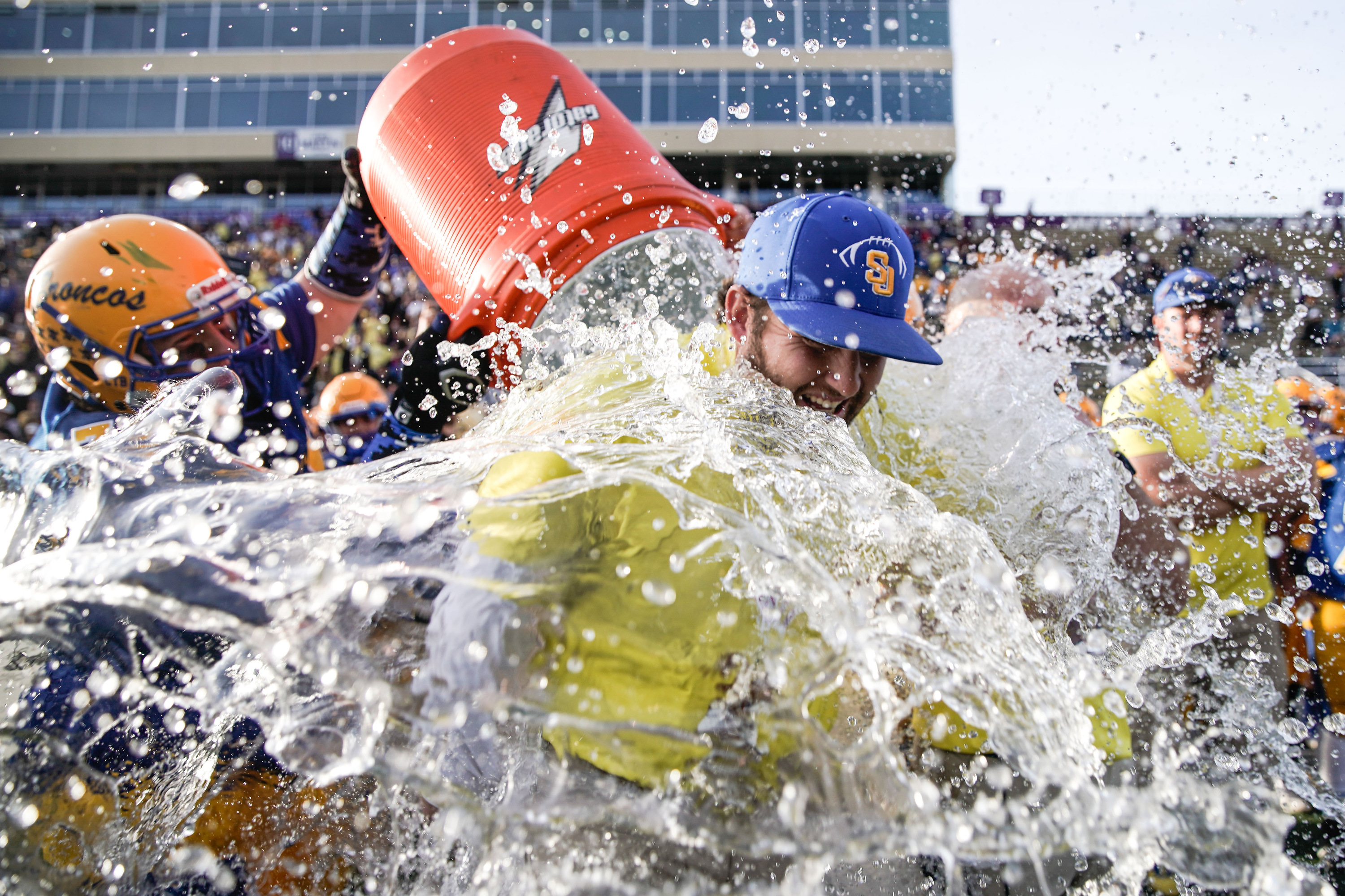San Juan’s Dylan Black dumps water on head coach Barkley Christensen after their win against Beaver in the 2A football championship game on Saturday, Nov. 13, 2021 at Stewart Stadium in Ogden.