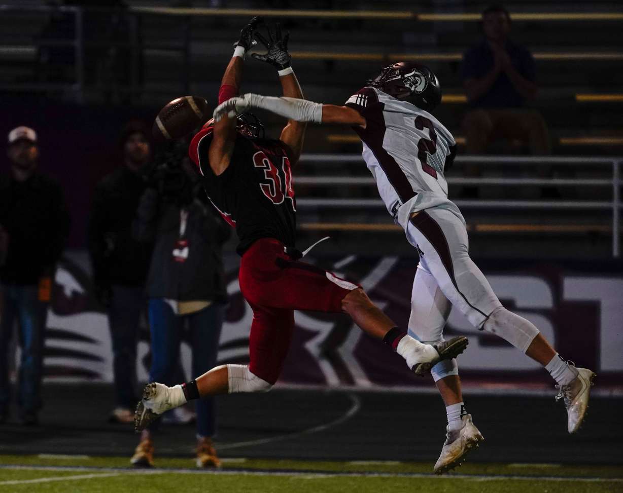 Grantsville’s Ethan Rainer, left, reaches for a pass as Morgan’s Robby Cameron, intercepts in the 3A football championship game on Saturday, Nov. 13, 2021 at Stewart Stadium in Ogden.