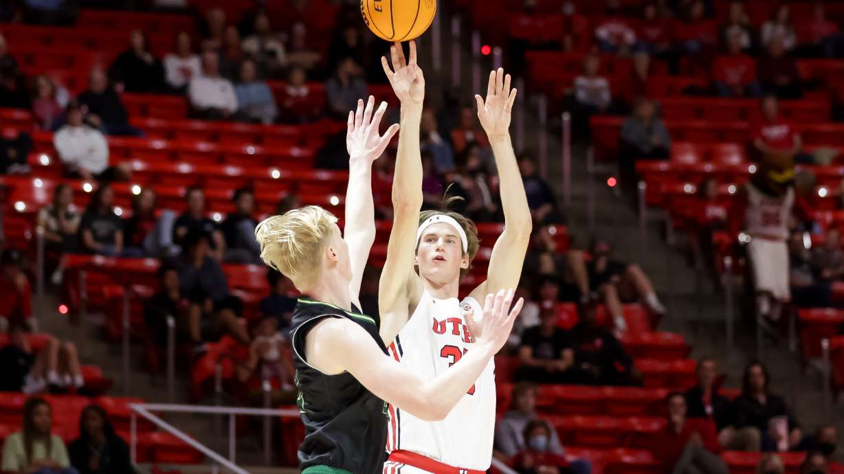 Utah Utes center Branden Carlson (35) shoots over Sacramento State Hornets center Hugo Clarkin (32) at the Huntsman Center in Salt Lake City on Saturday, Nov. 13, 2021.